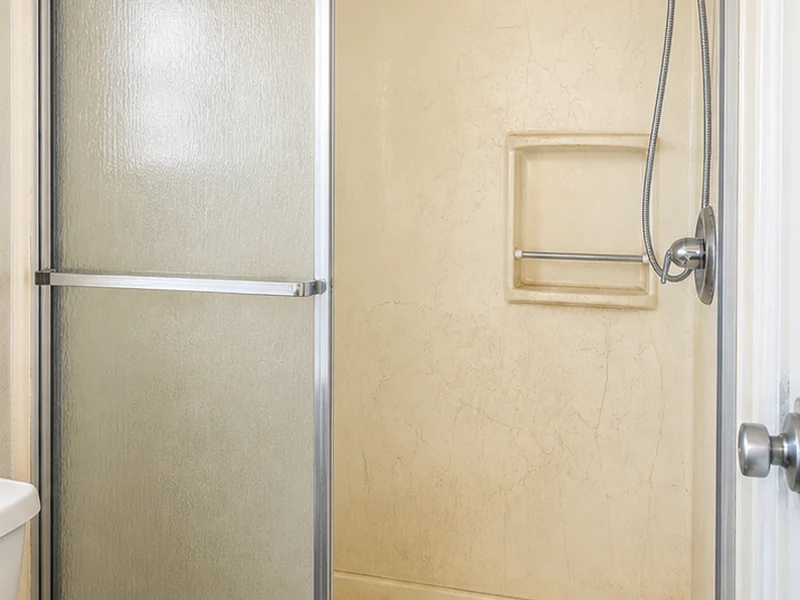 Faded, crazed fiberglass tub-and-shower unit before reglazing in a Berryessa rental, San Jose